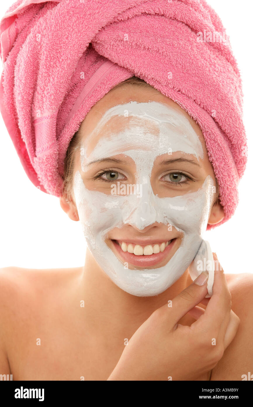 Young woman with facial mask Stock Photo