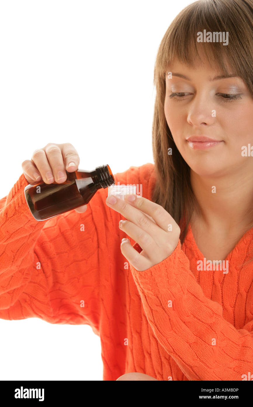 Young woman dosing medicine Stock Photo