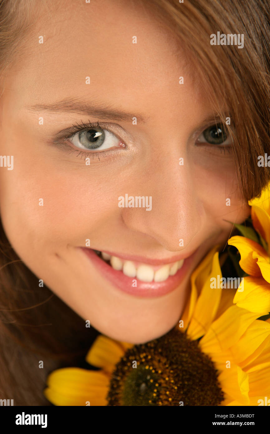 Young woman with sunflower Stock Photo - Alamy
