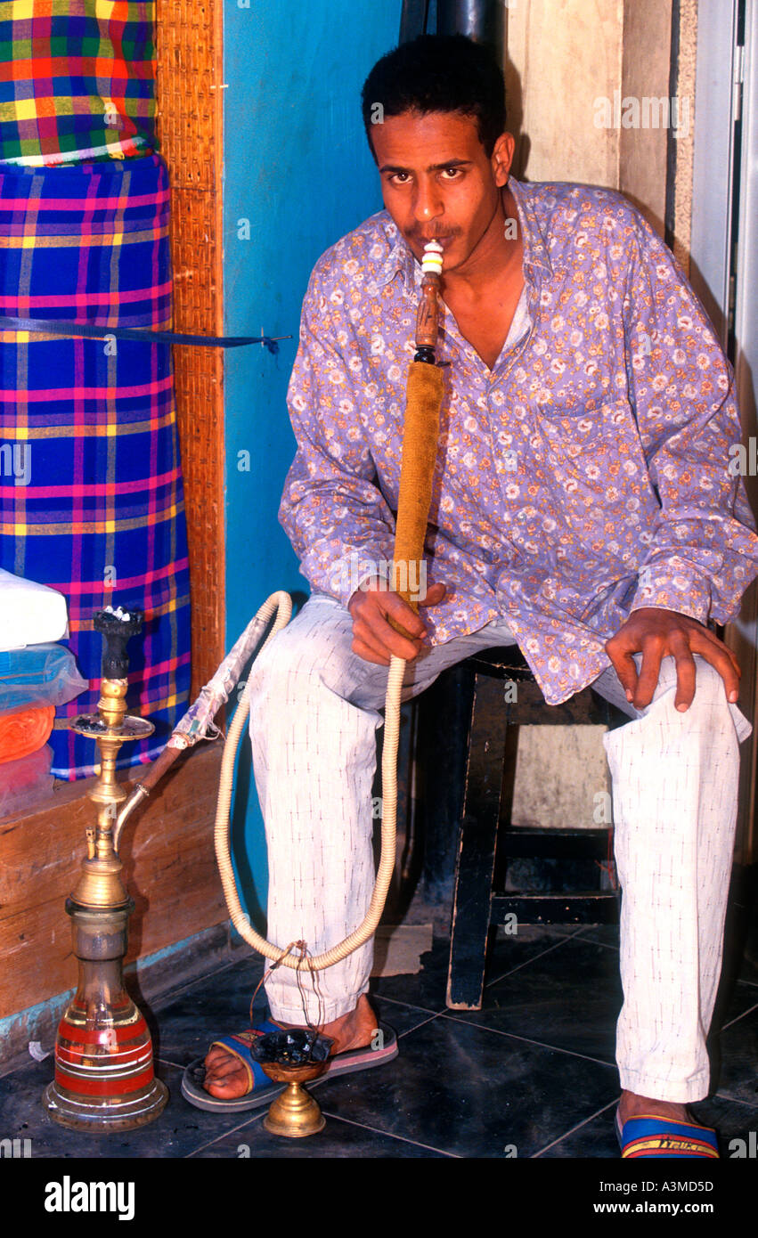 Young man smoking water pipe or hookah Egypt Stock Photo Alamy