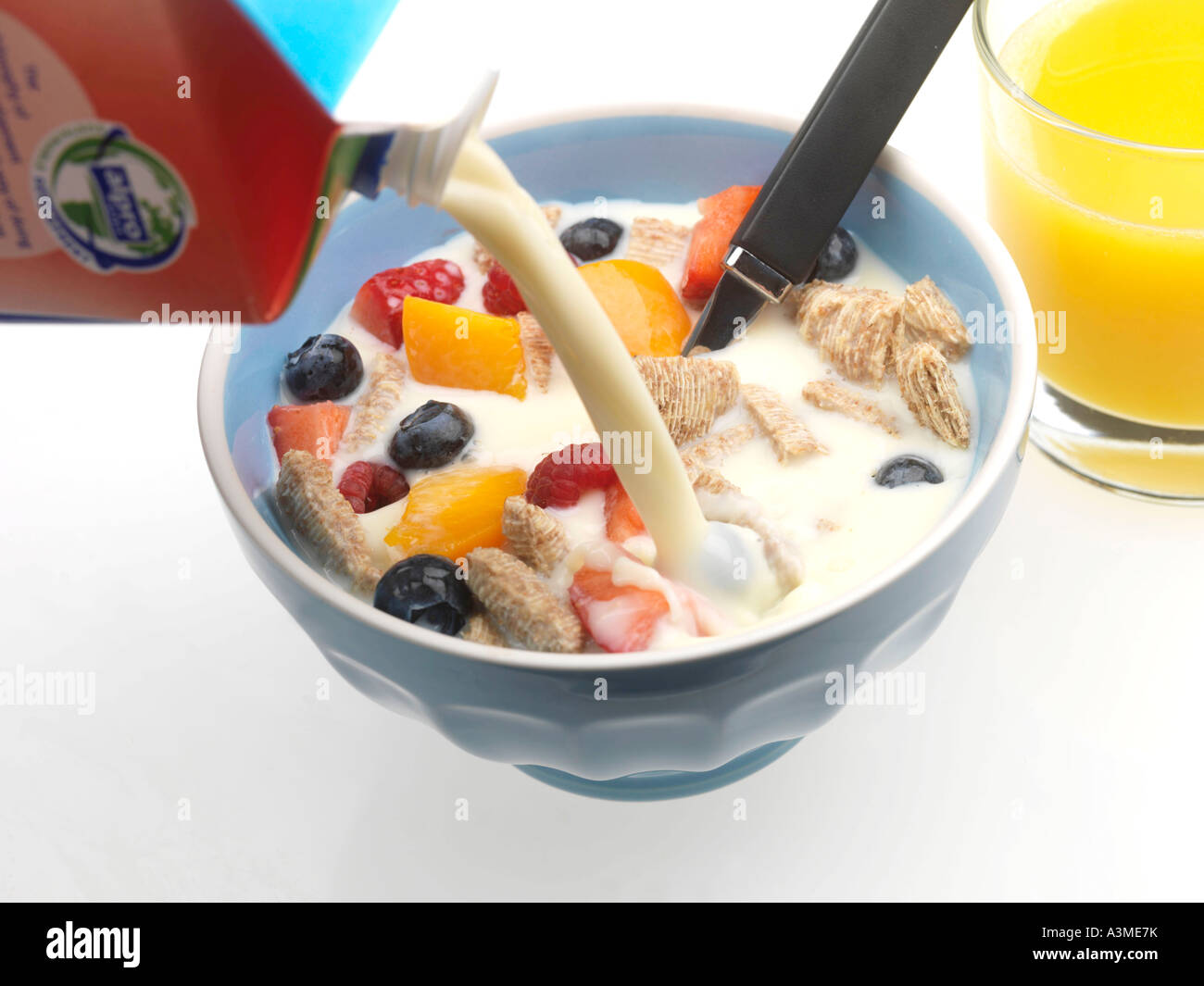 Pouring soya milk onto cereal with fresh fruit hires stock photography and images Alamy