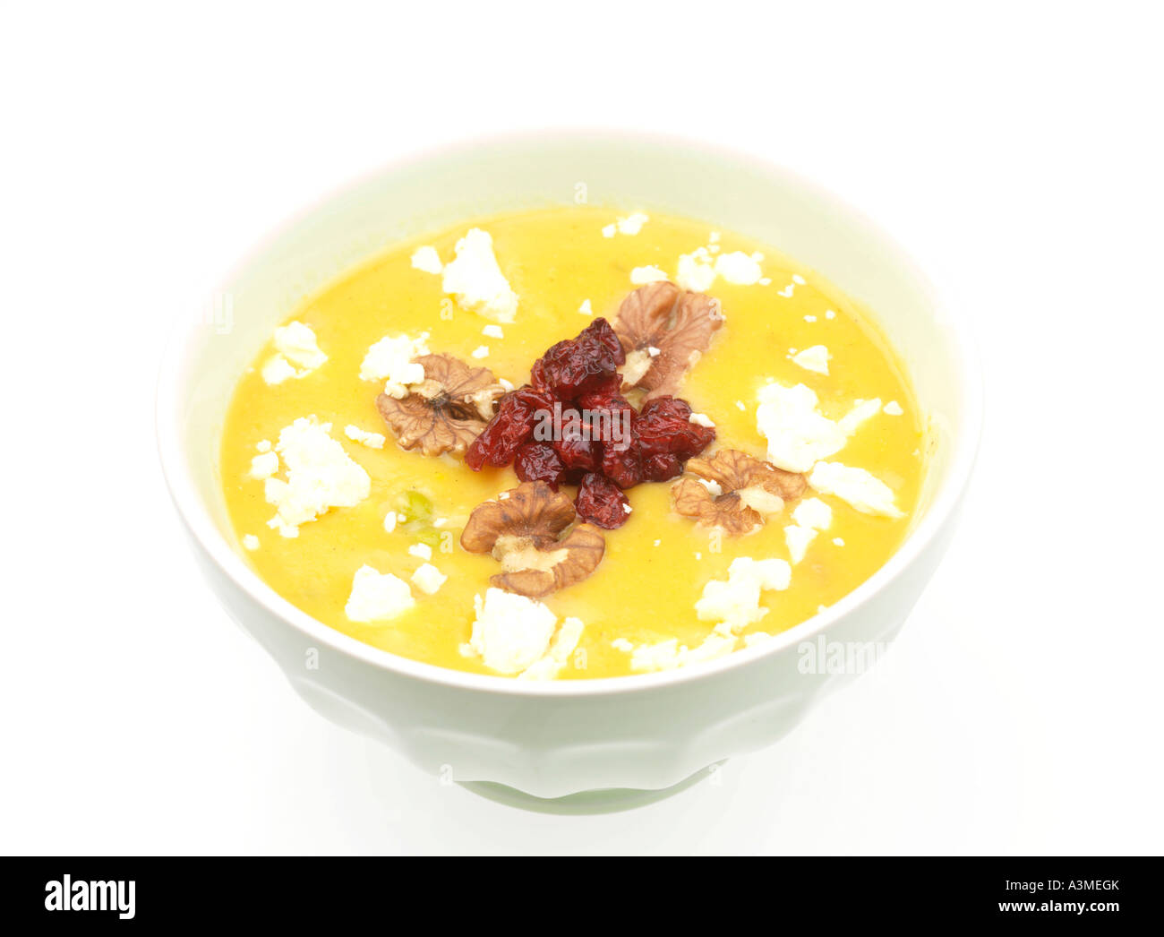 Vegetable Soup with Cranberry and Walnut Garnish Stock Photo