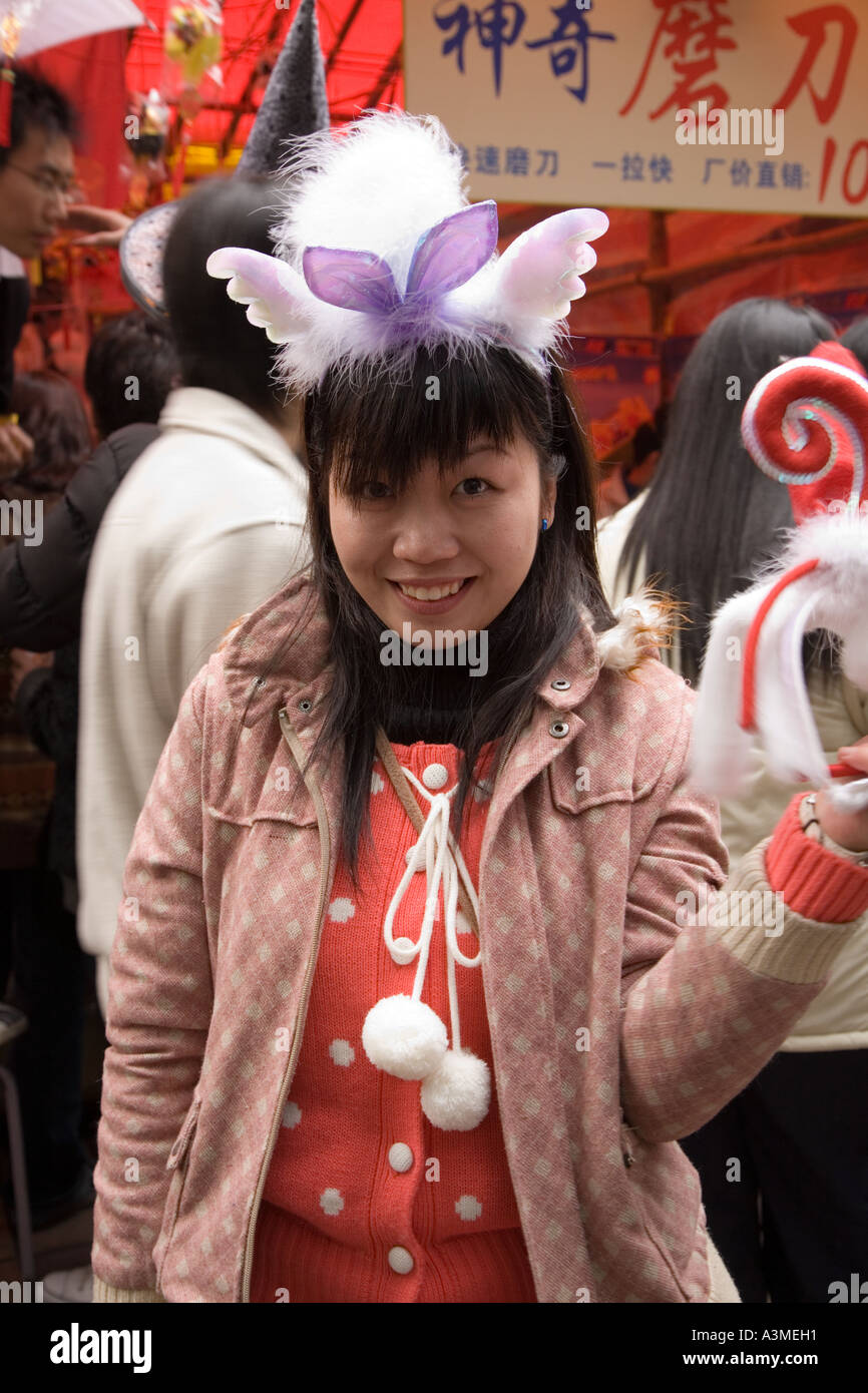 Happy girl at the flower festival in Guangzhou - China during Chinese New year. Stock Photo