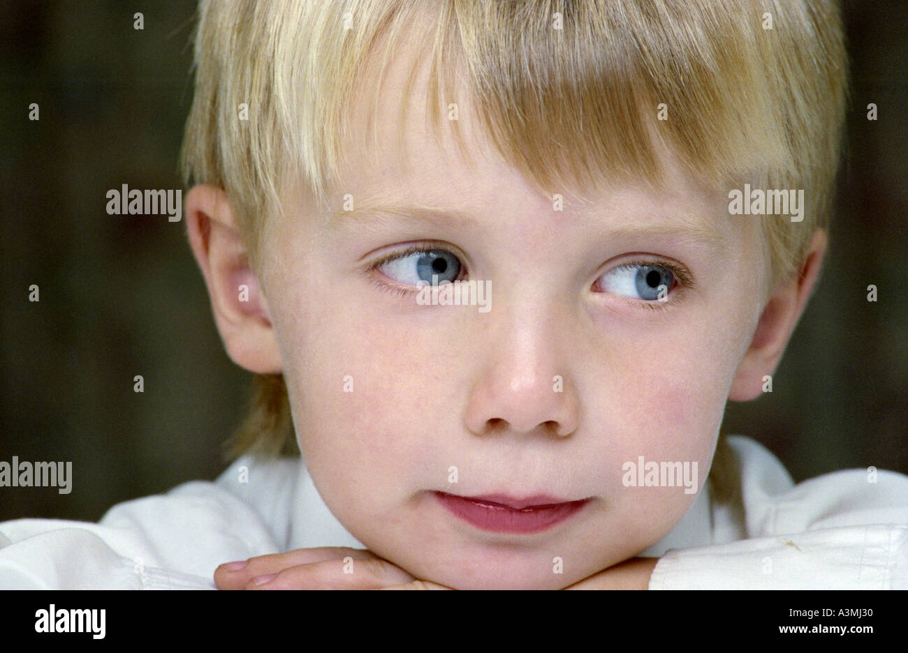 Young boy blue eyes and blond hair with fringe Stock Photo - Alamy