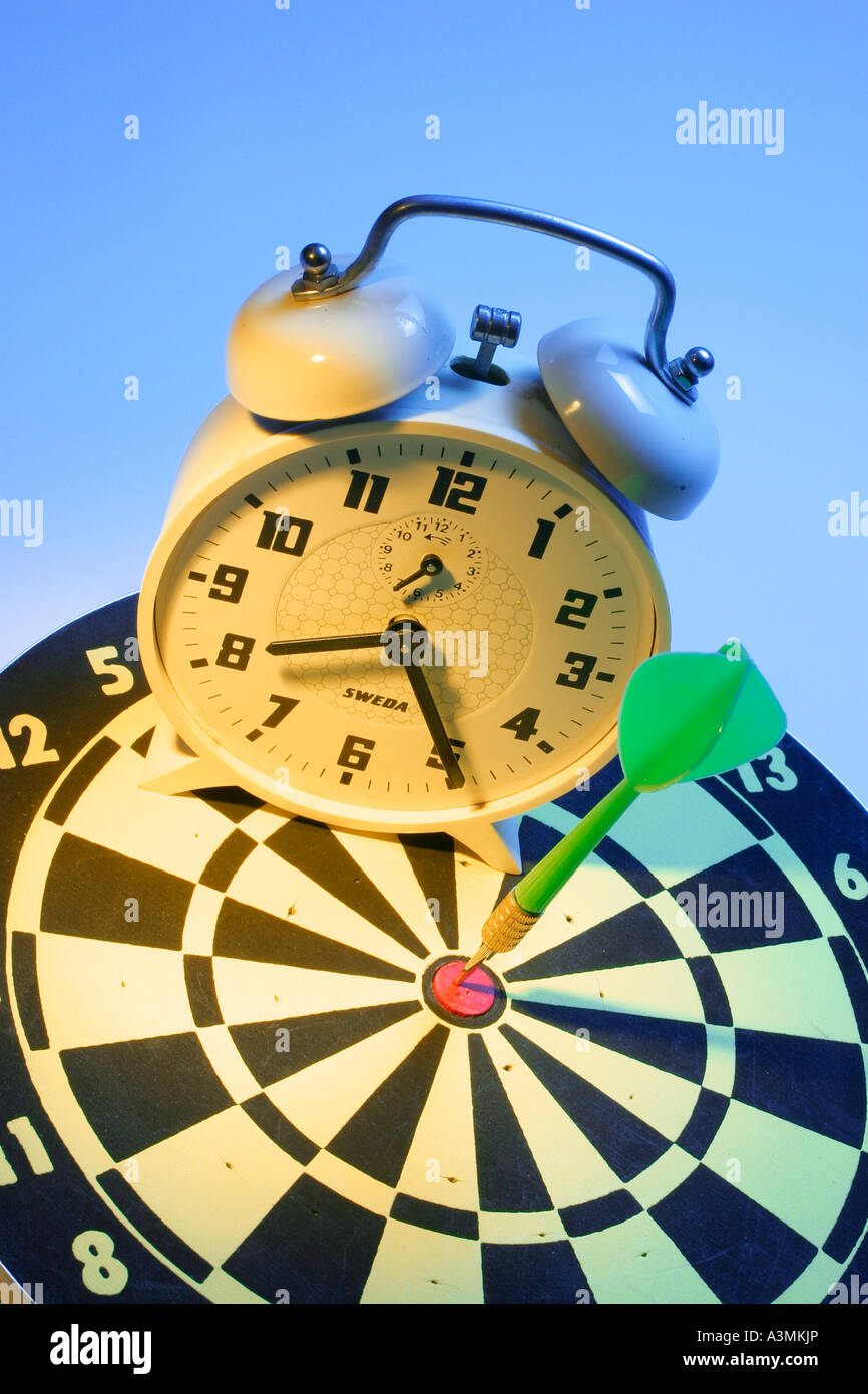 Alarm Clock on Dartboard Stock Photo Alamy