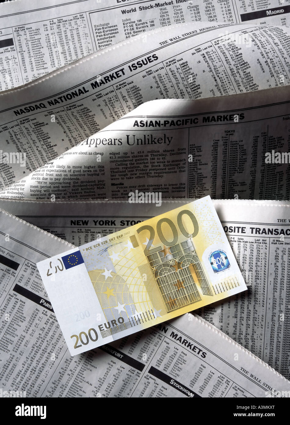 200 EURO BANKNOTE WITH FINANCIAL PAPERS Stock Photo - Alamy