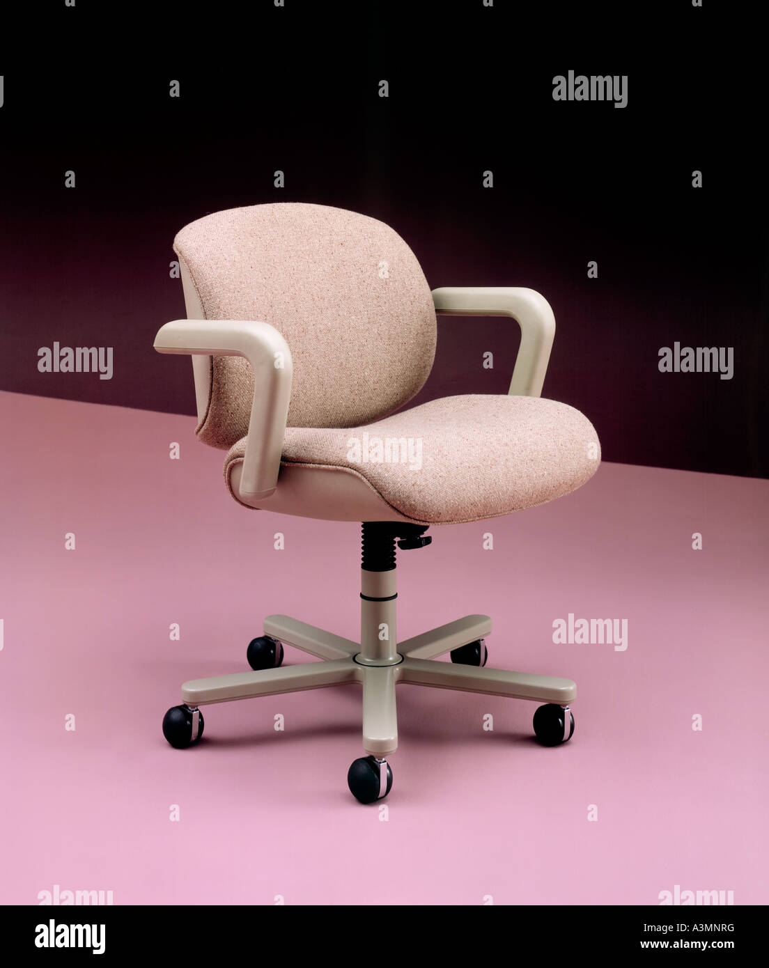 business furniture chair roller casters armrest arm rest pink floor background Stock Photo