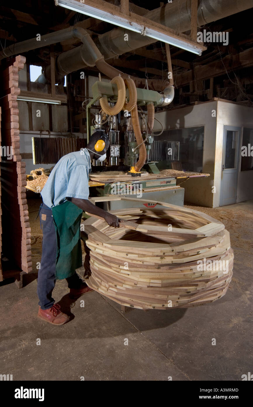 Cutting the outer perimeter of table from Odum wood using a CNC machine