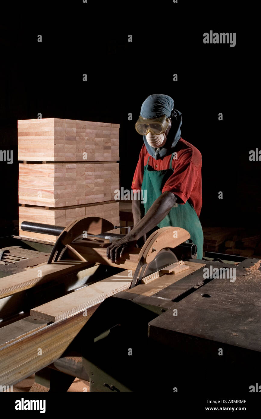 African carpenter cutting wooden hires stock photography and images