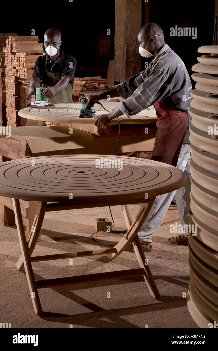 Sanding of an Odum wood table top for export to UK, Ghana, West Africa Stock Photo
