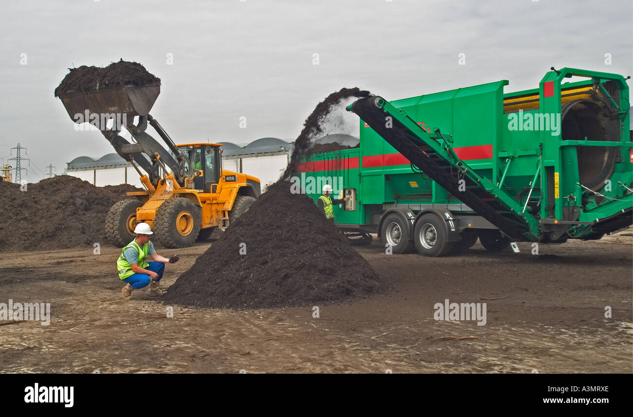 Commercial composting plant operation. Screening compost before storage