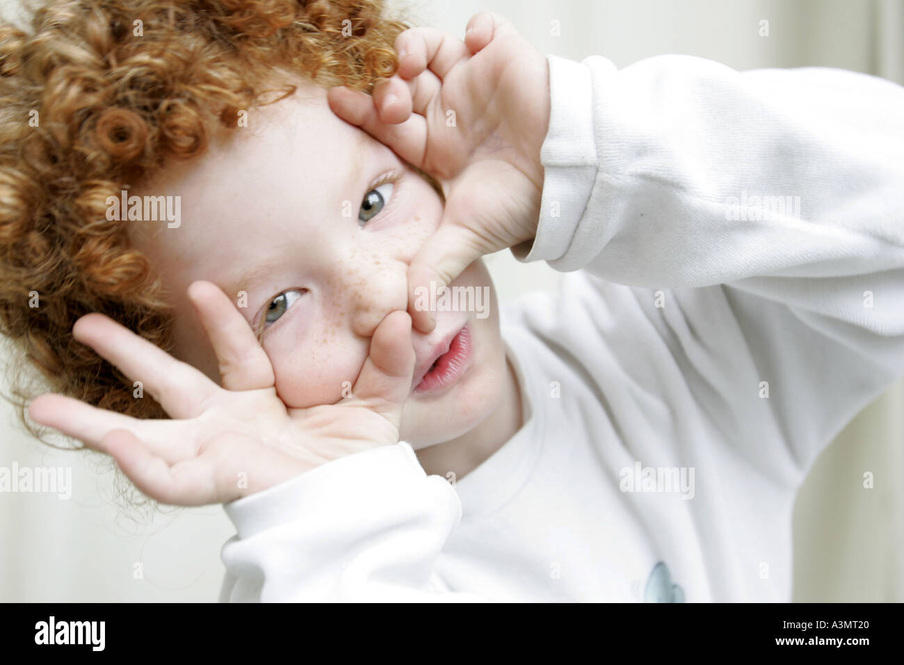 Boy framing for a picture Stock Photo