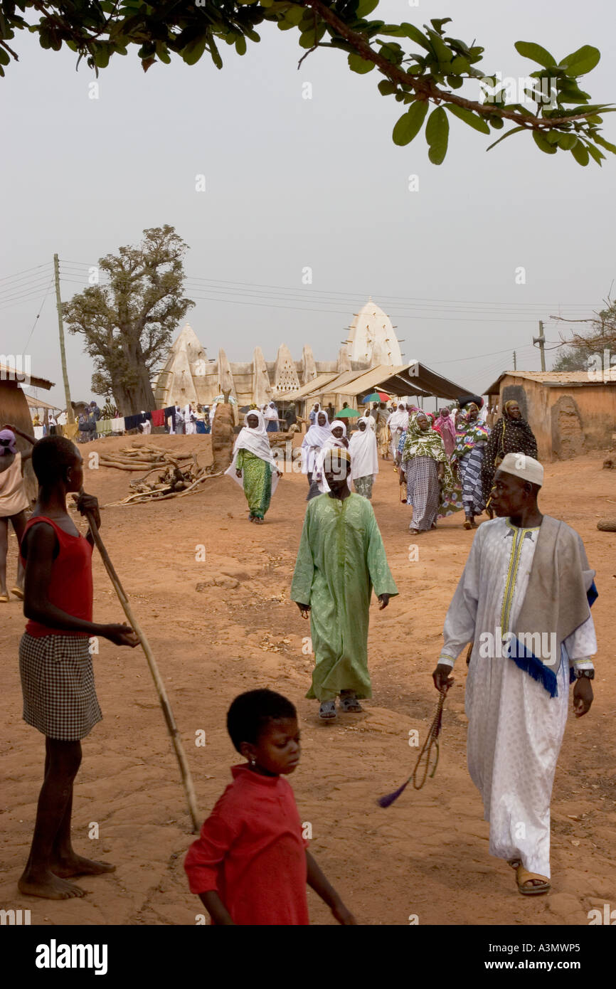 Village worshippers leaving Larabanga Mosque after Friday Prayers, Larabanga, Northern Ghana, West Africa. Stock Photo