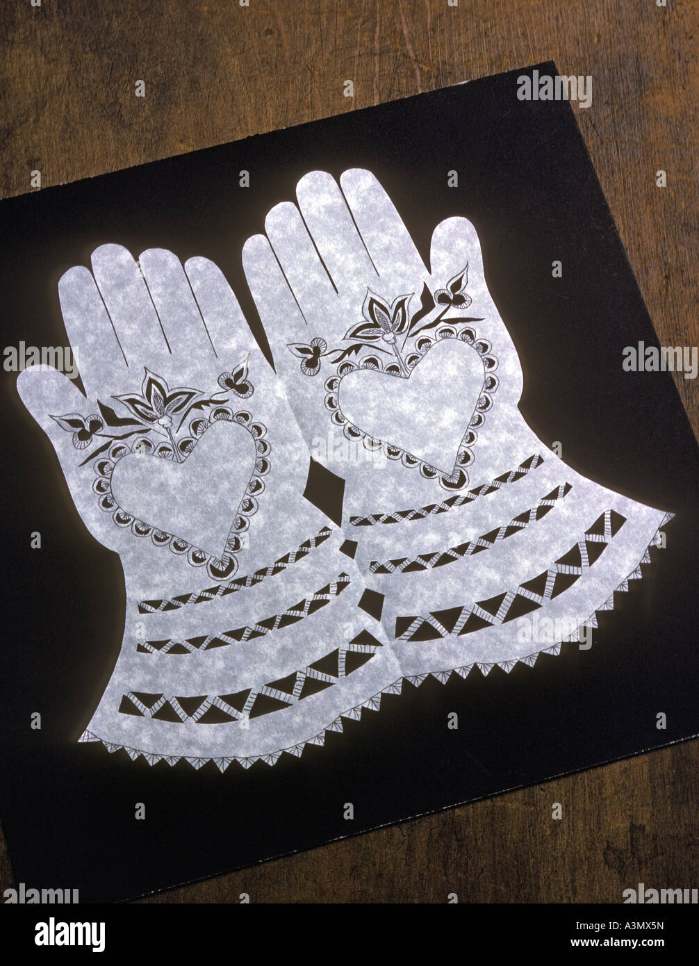 Scherenschnitte which means scissor cuts in German is the art of cutting continuous paper