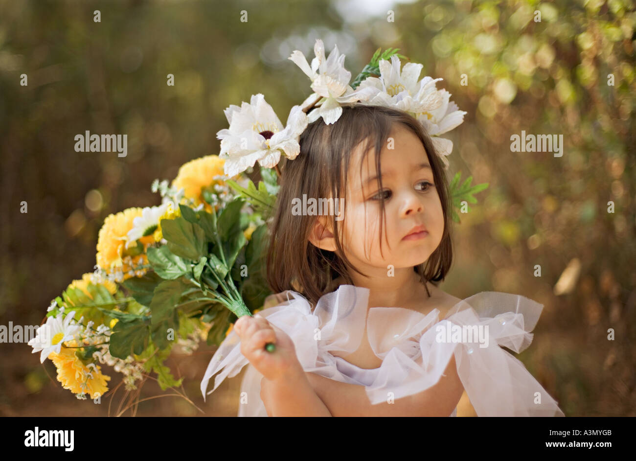 Pretty little girl in the woods Stock Photo