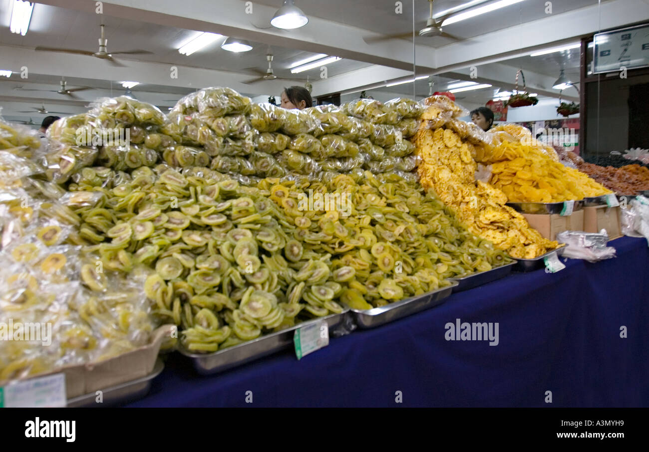 CHINA XI'AN Shop in Xi'an selling wide variety of dried fruits and nuts including stacks of dried kiwis and pineapples Stock Photo