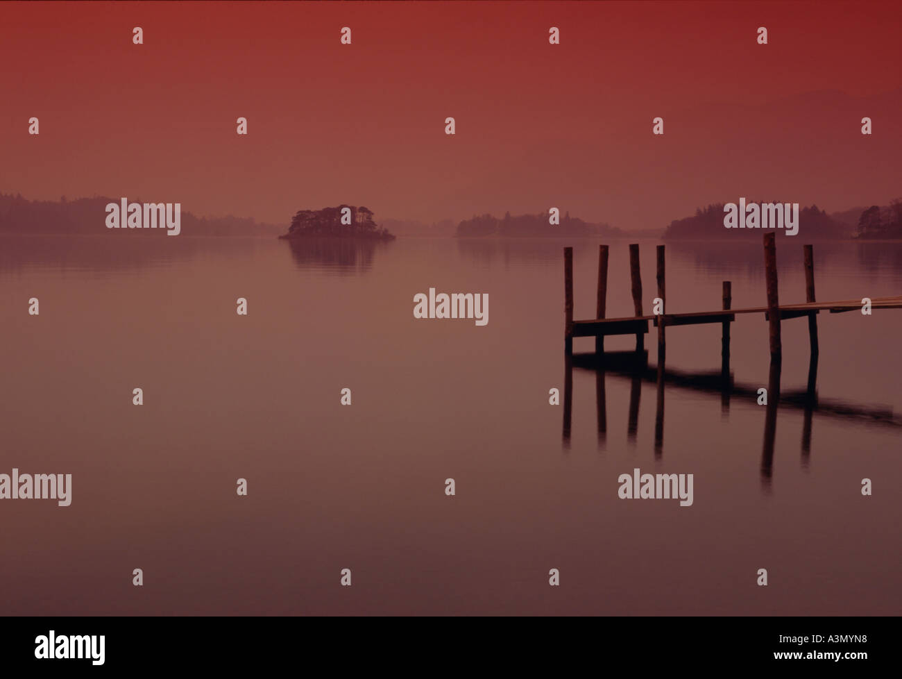 Tranquil landscape scene of Derwent Water jetty looking north east over to St. Herbert's Island and Skiddaw. Cumbria. Stock Photo