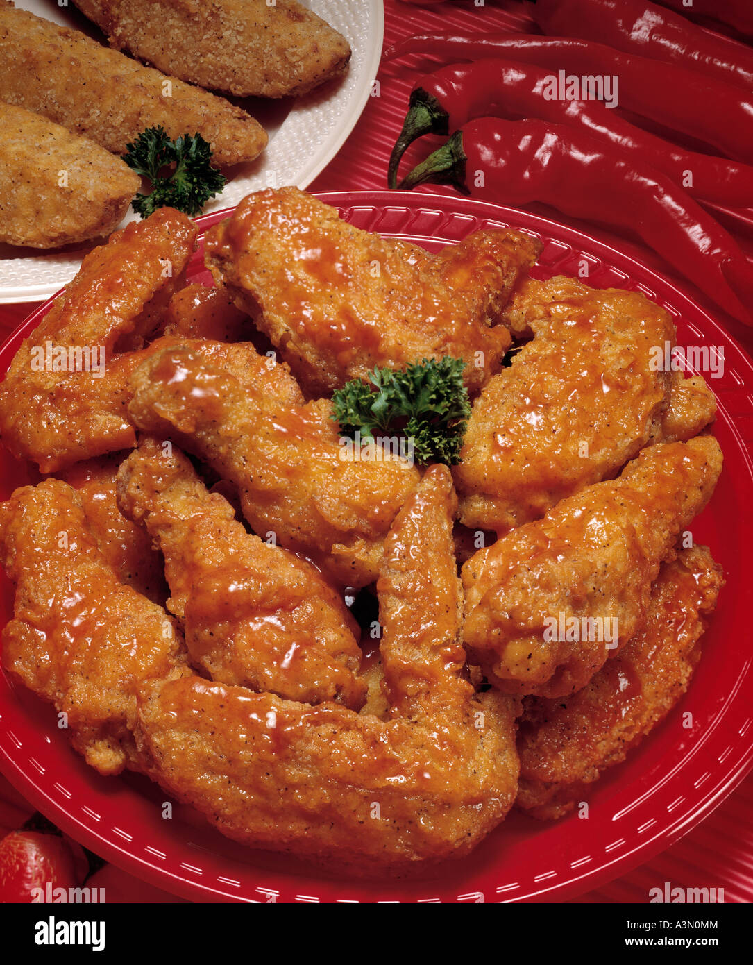 red hot chili peppers chicken wing legs potato potatoe wedges Stock