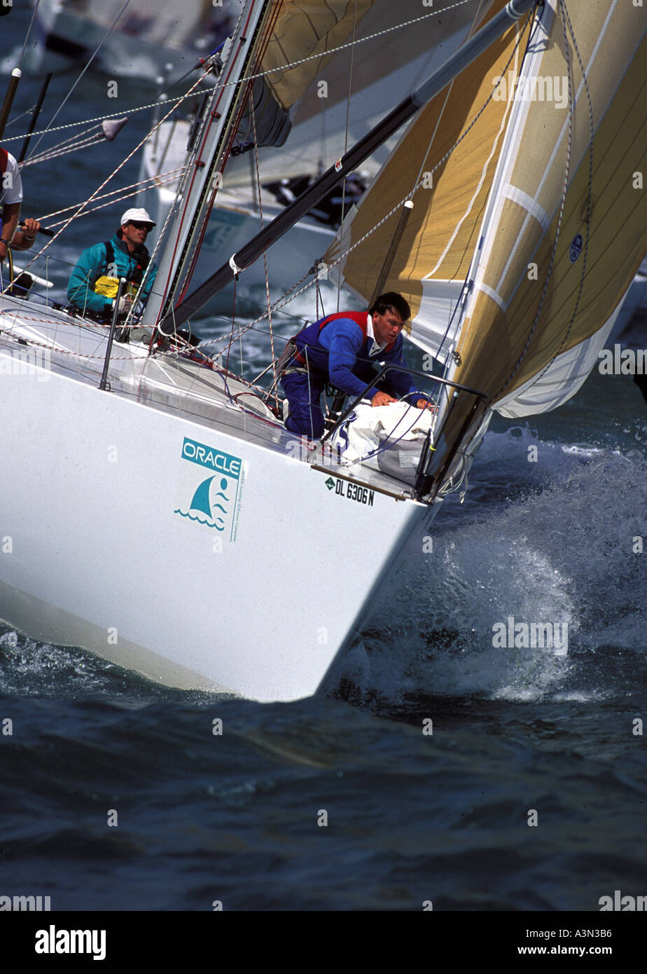 Bowman prepares sail on foredeck of a racing yacht Stock Photo - Alamy