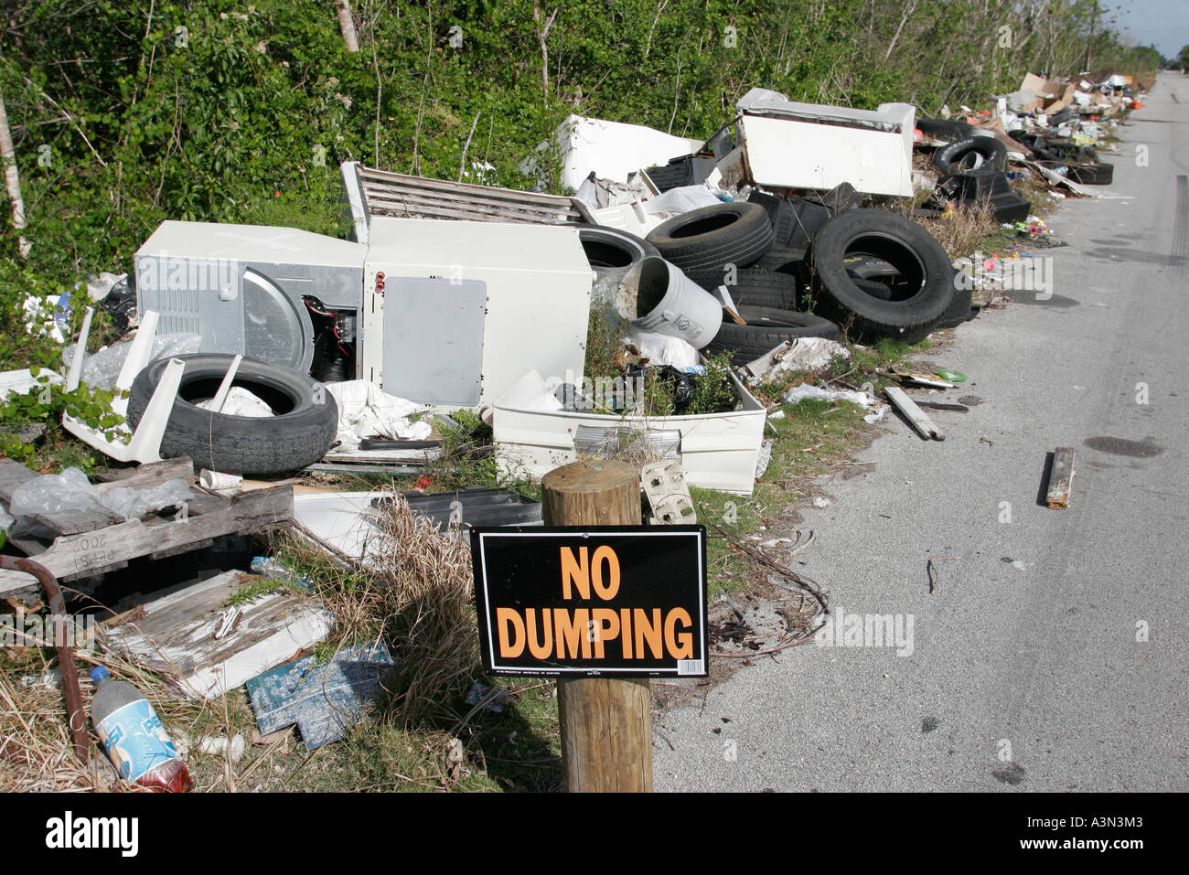 Miami Florida,Homestead,illegal dumping site,roadside,tires,appliances,trash,pollution,litter,trash,pollution,clutter,trash,FL060130447 Stock Photo