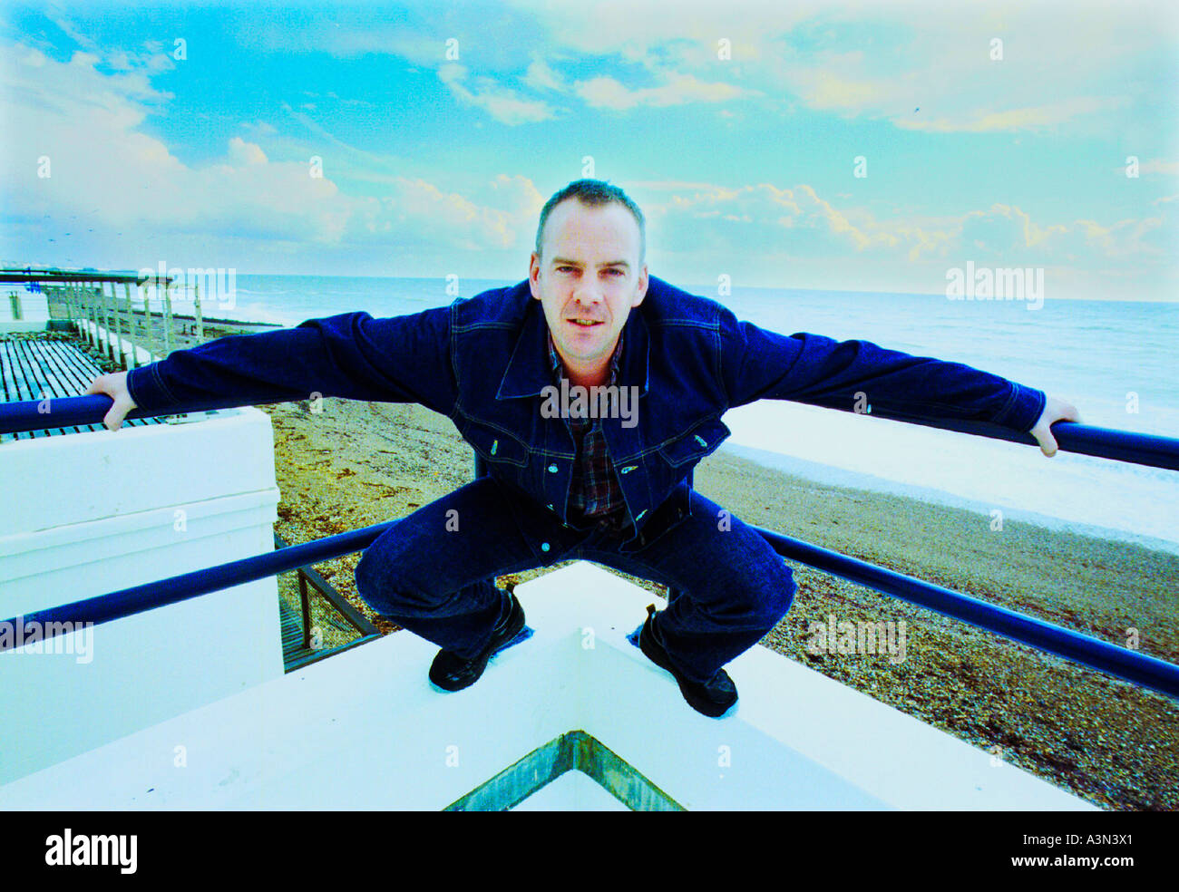 Norman Cook alias DJ musician Fat Boy Slim on the balcony  of his Brighton seafront home Stock Photo