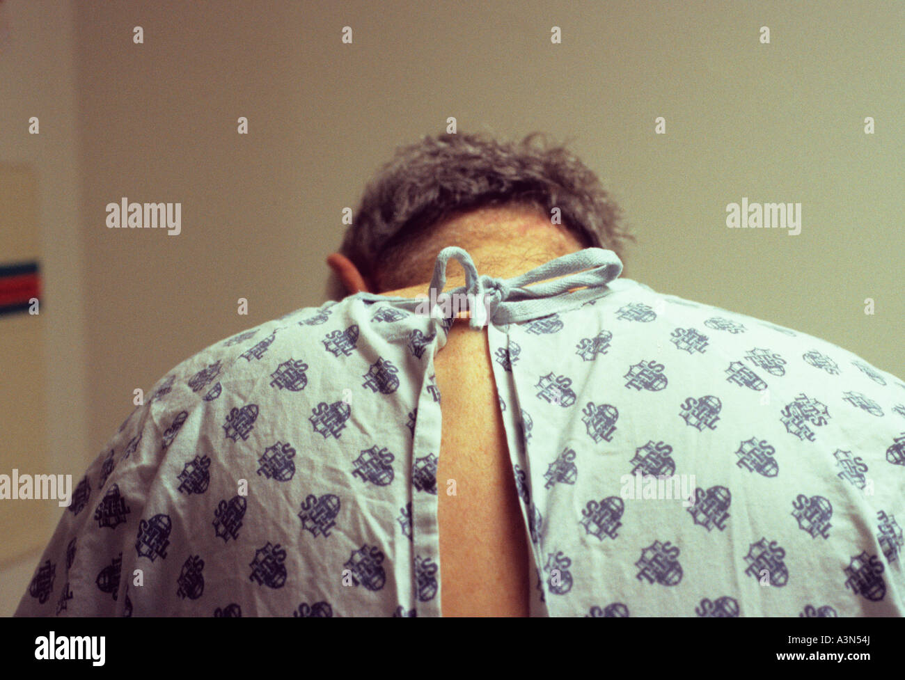 New York City NYC Senior Male Patient in a Hospital Gown Waiting to Be Examined USA Stock Photo