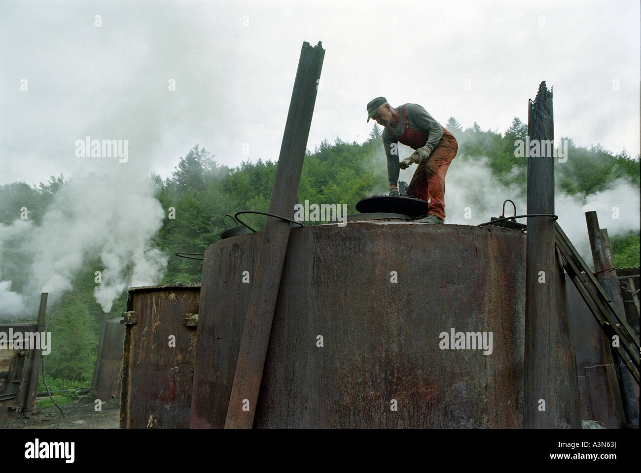Charcoal burner working on the production of charcoal in the Bieszczady