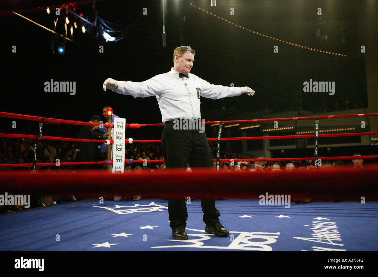 Referee Calls Boxers From Their Corners During A Boxing Match At