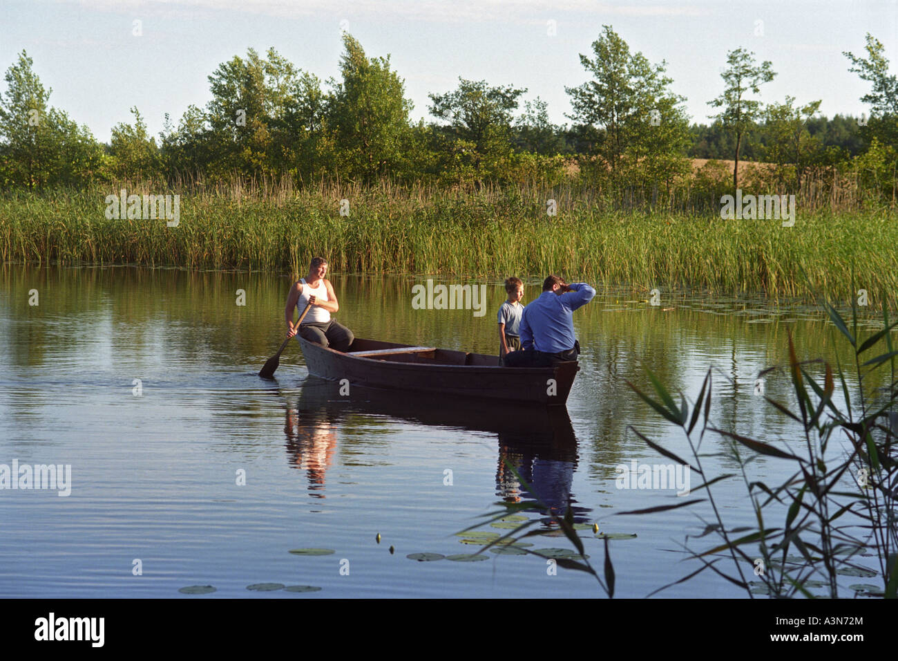 People in a boat on a lake, Suwalki, Poland Stock Photo