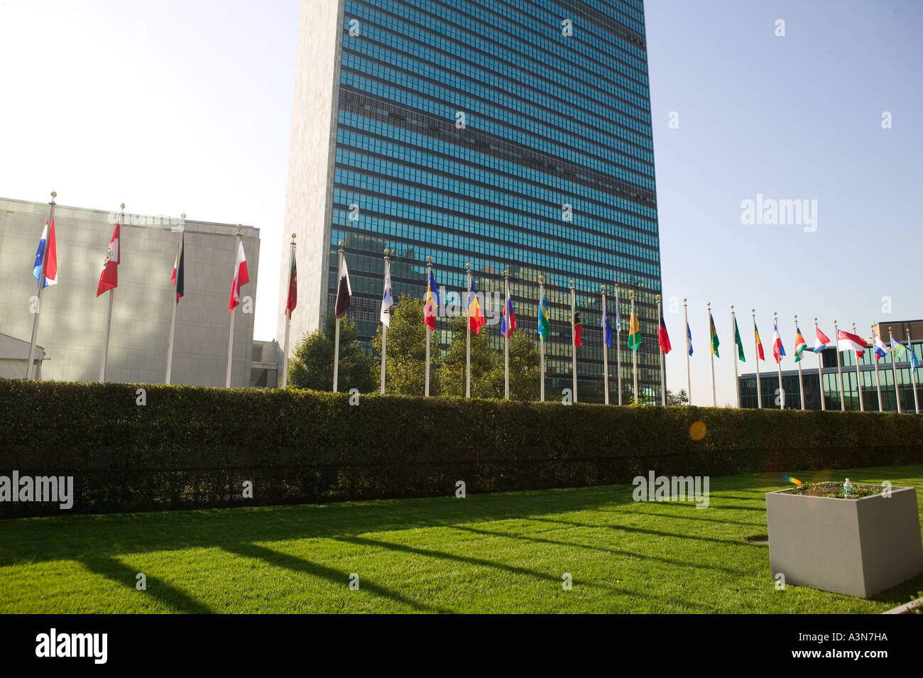 Member states flags fly on poles in front of UN general secretariat building on 1st avenue in New York City NY USA September Stock Photo