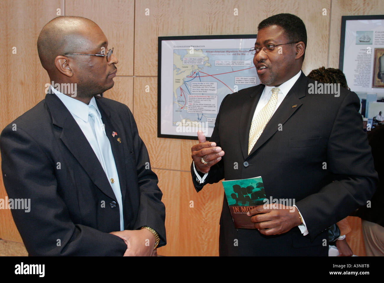 Miami Florida,Overtown,historic Lyric Theater,theatre,reception,Black Blacks African Africans ethnic minority,men,talk,visitors travel traveling tour Stock Photo