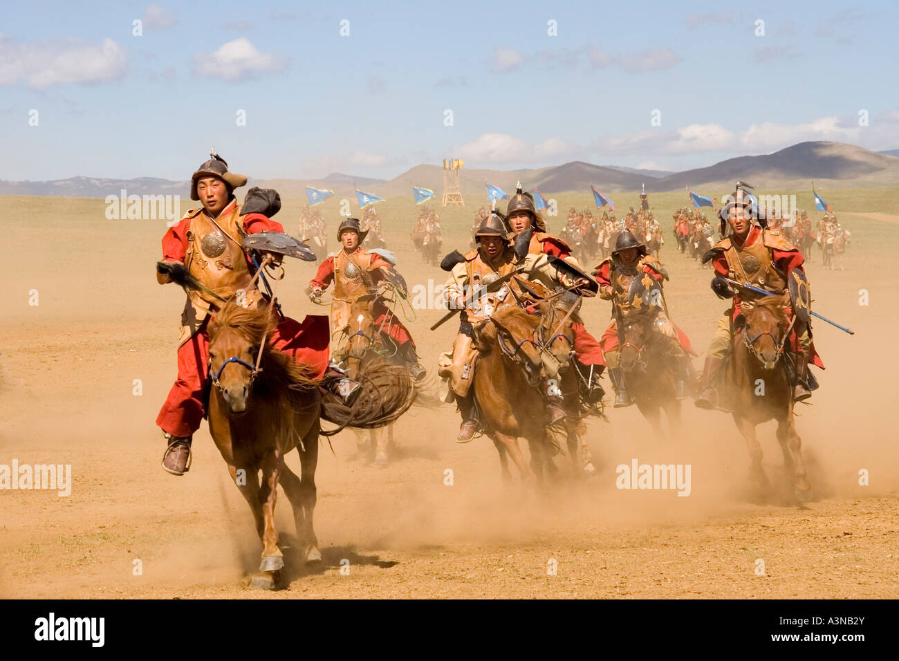 Mongolian armed horsemen charging with spears and shields Stock Photo