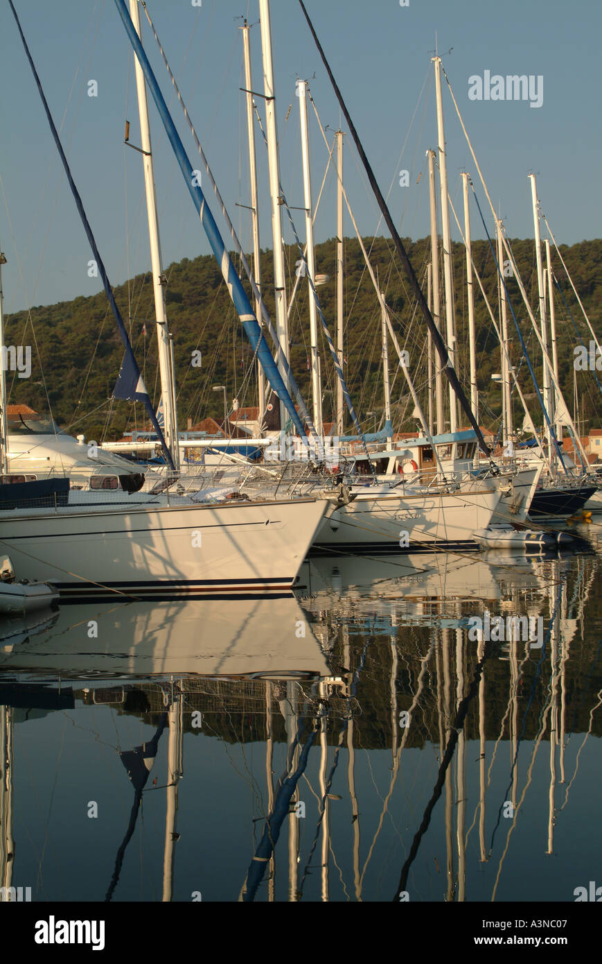Yachts Reflect in Still Morning Air at Veli on Otok Iz Island Croatia Stock Photo