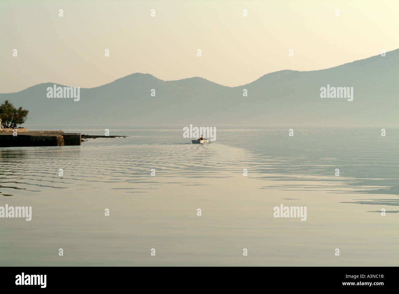 Fisherman in His Boat Off to Sea Near Veli Otok Iz Island Croatia Stock Photo