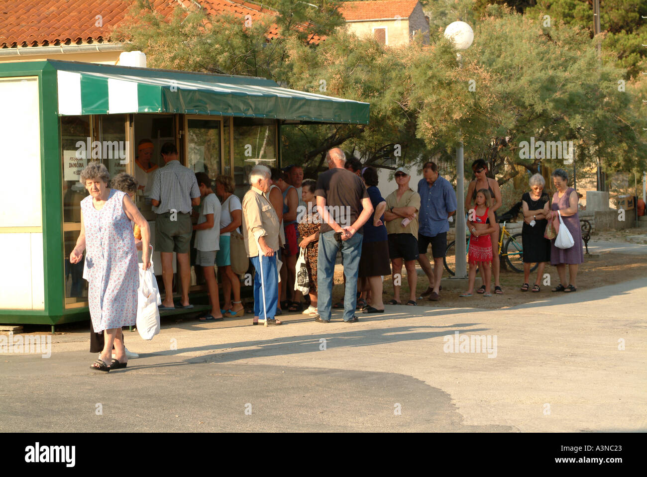 Locals and Tourists Queue for Bread at Bakery at Veli on Otok Iz Island Croatia Stock Photo