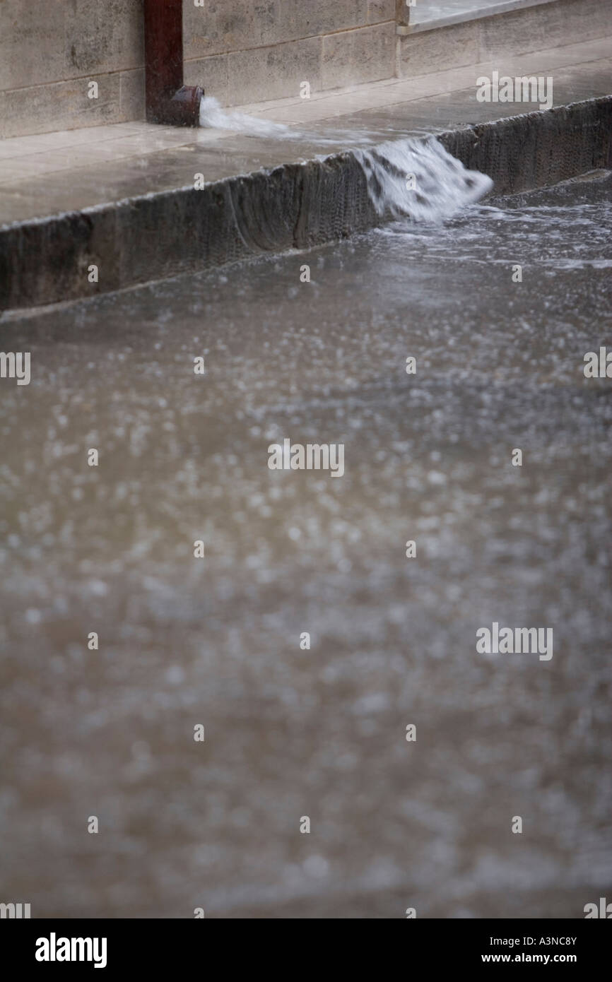Heavy rain flooding out of drain pipe, Italy Stock Photo Alamy