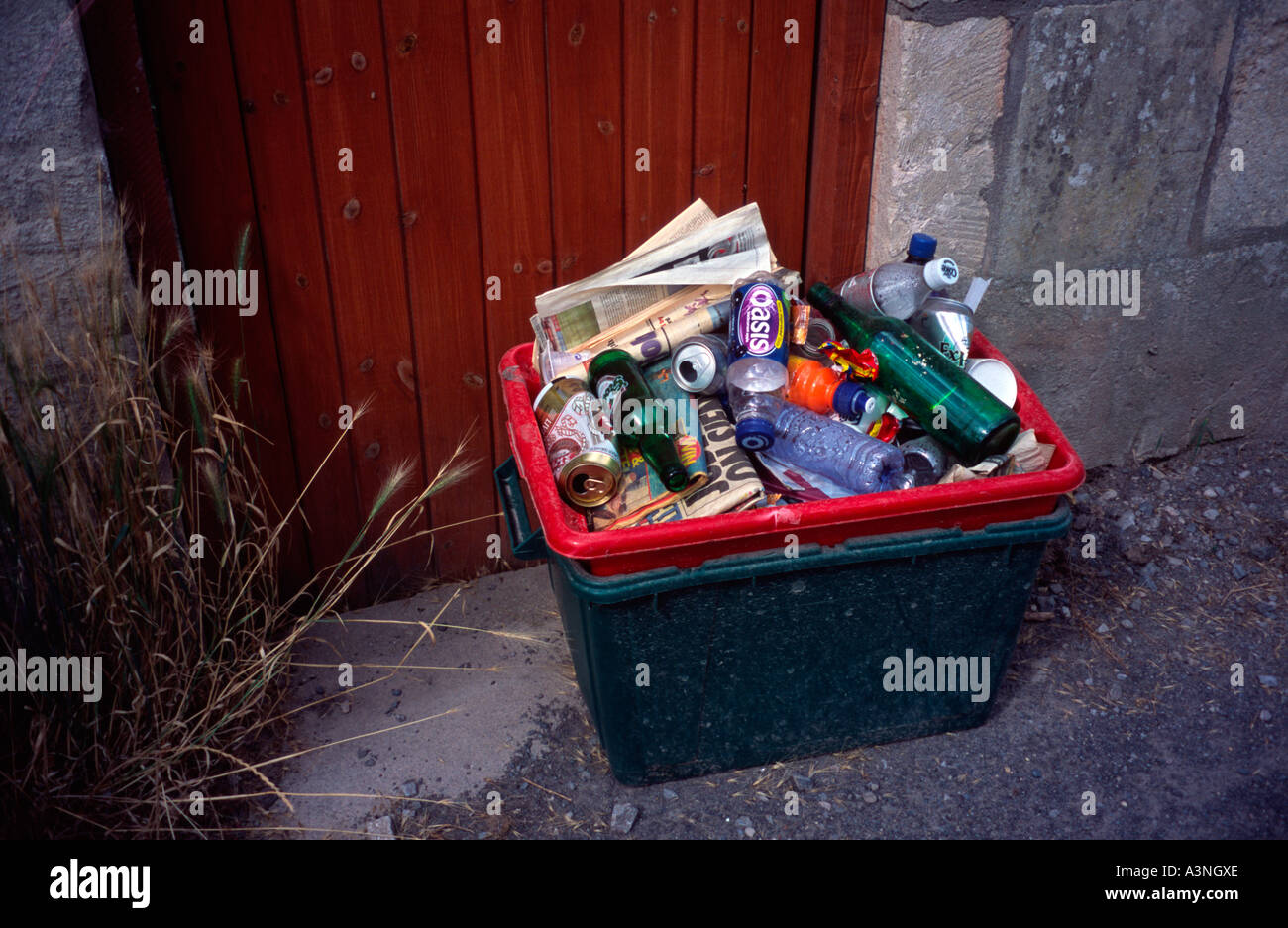 Recycling green box outside house waiting to be collected, Bath Spa