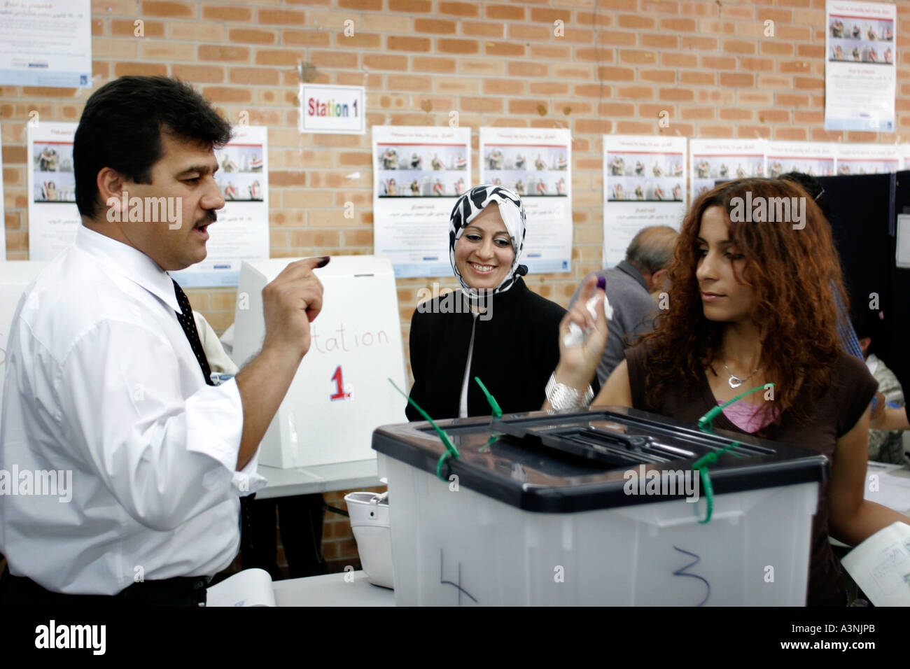 Smiling Muslim women voting in democratic elections for an Iraqi government Stock Photo