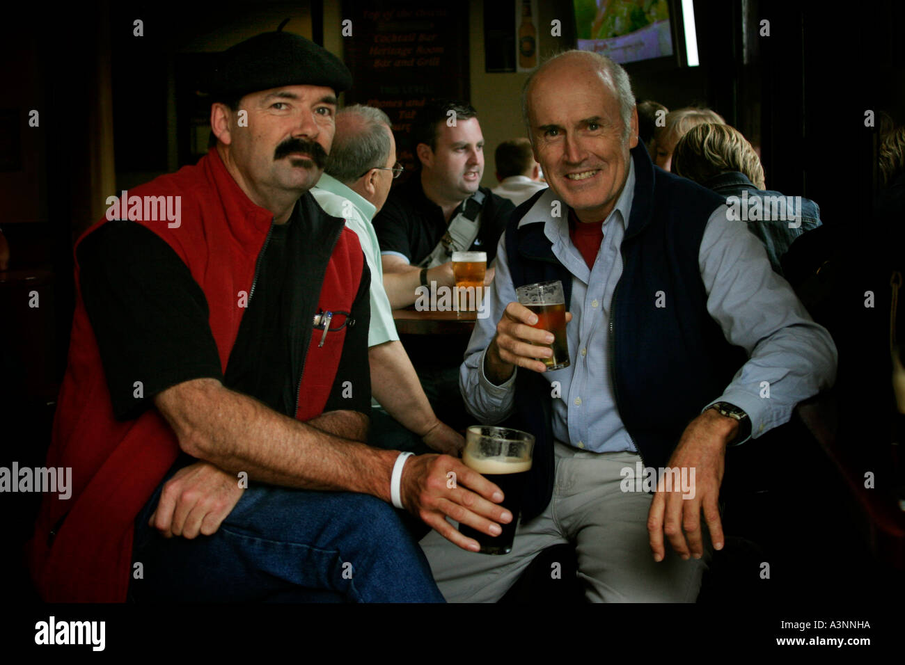 Men having a drink in a pub in the Rocks in Sydney Australia Stock Photo