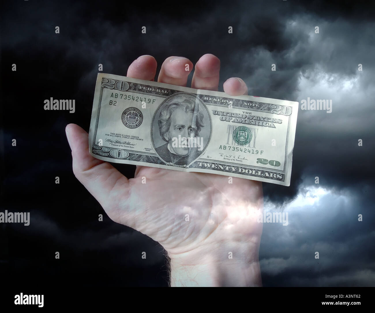 Hand holding money US twenty dollar bill Stock Photo