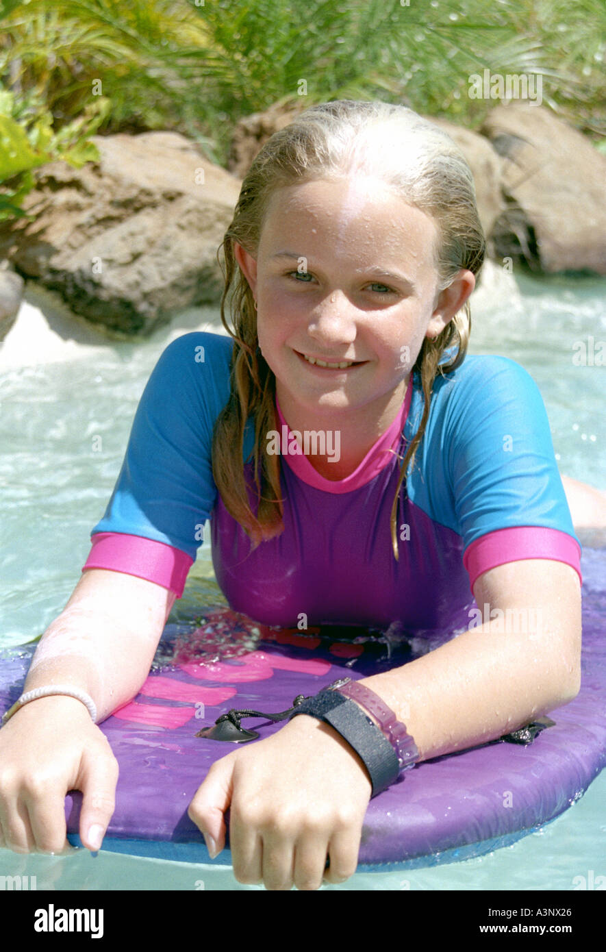 12 YEAR OLD GIRL IN A SWIMMING POOL Stock Photo