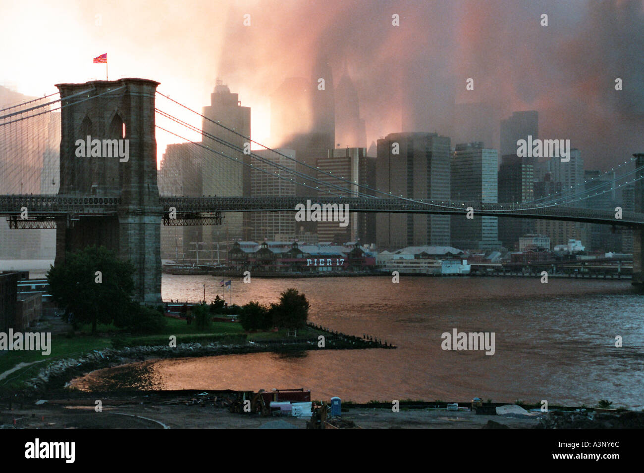 Lower Manhattan skyline and Brooklyn Bridge from under the Manhattan Bridge DUMBO sunset September 11 2001 Stock Photo