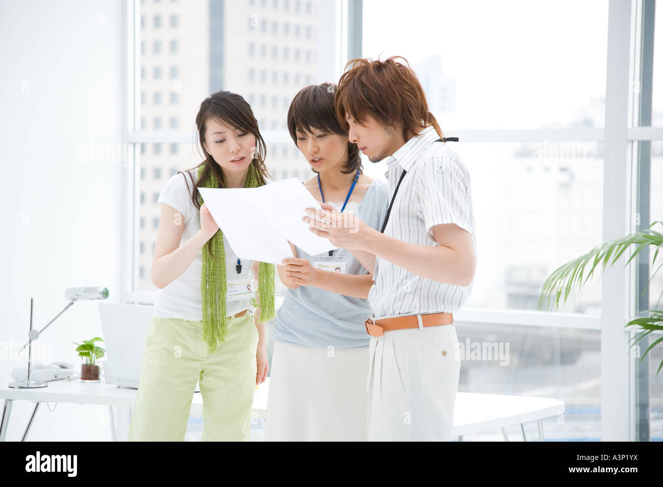 Three people talking Stock Photo