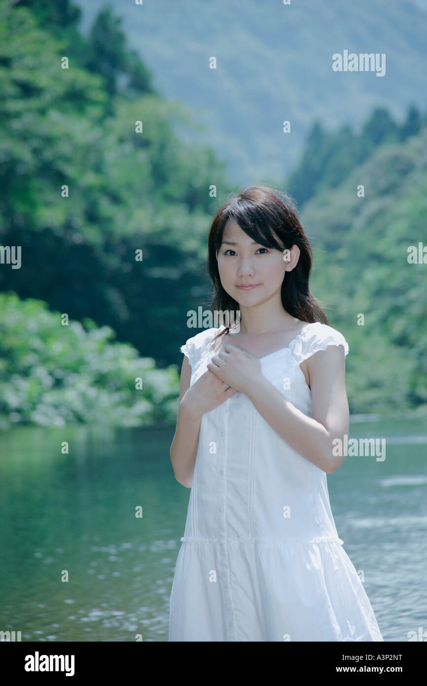 A young woman standing in river Stock Photo - Alamy