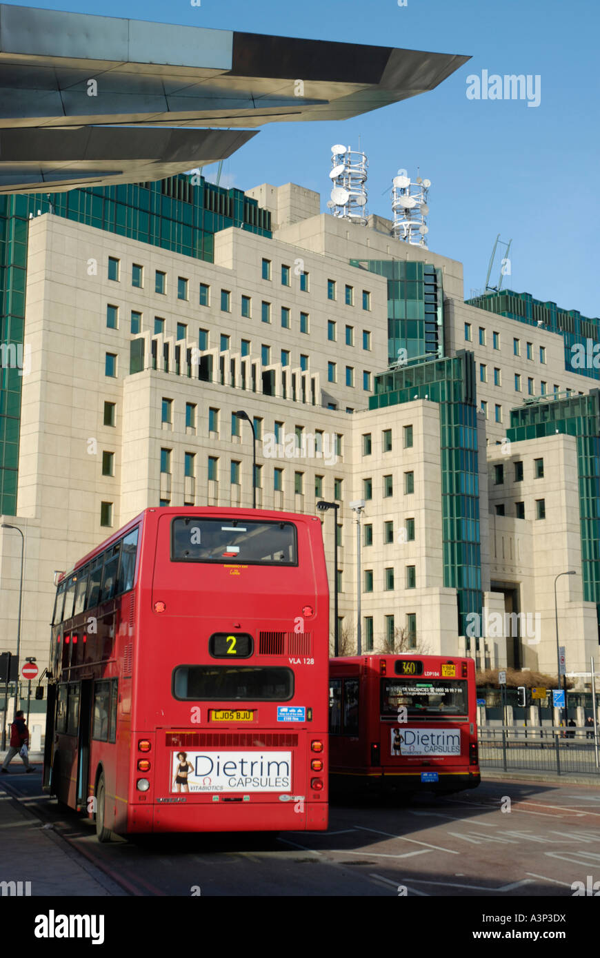 View of MI6 intelligence service headquarters building with Vauxhall Cross bus station in the foreground Vauxhall London England Stock Photo