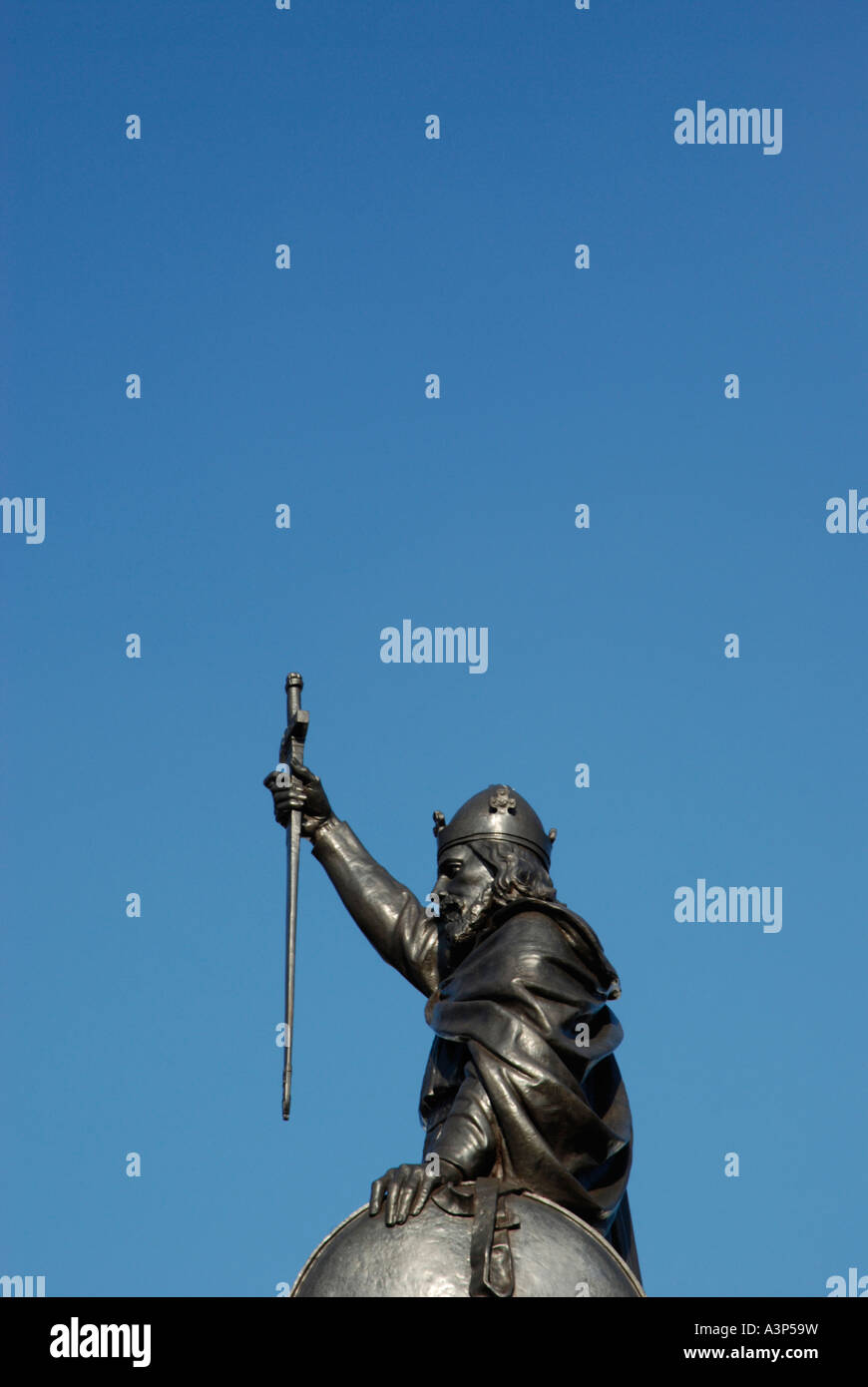 King Alfred statue against large area of plain blue sky Winchester Hampshire England Stock Photo