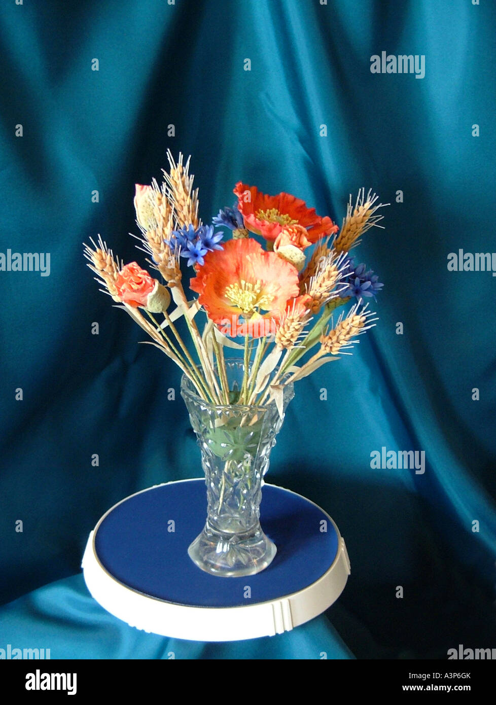Artificial flowers made from sugar on display in glass vase Stock Photo