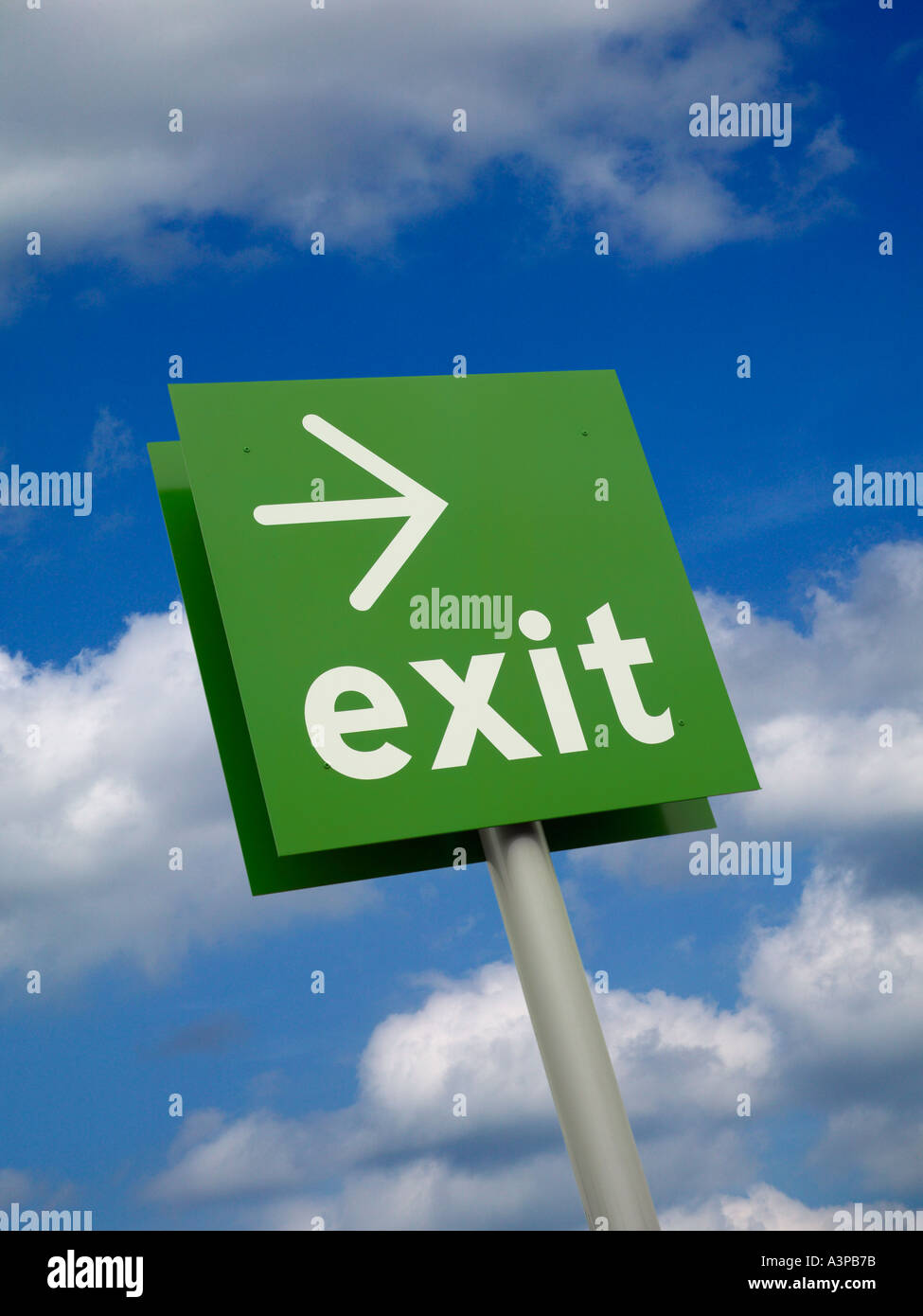 GREEN EXIT SIGN WITH BLUE SKY BACKGROUND Stock Photo - Alamy