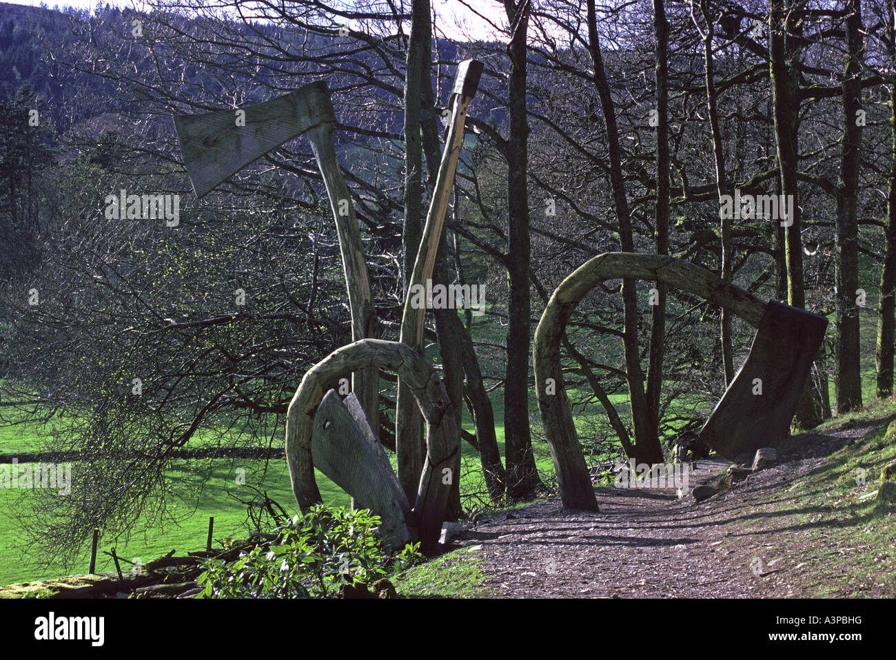 'Axe Life Cycle' 1991. Outdoor sculpture by Jeremy Cunningham. Grizedale Forest Park, Lake District National Park, Cumbria. Stock Photo