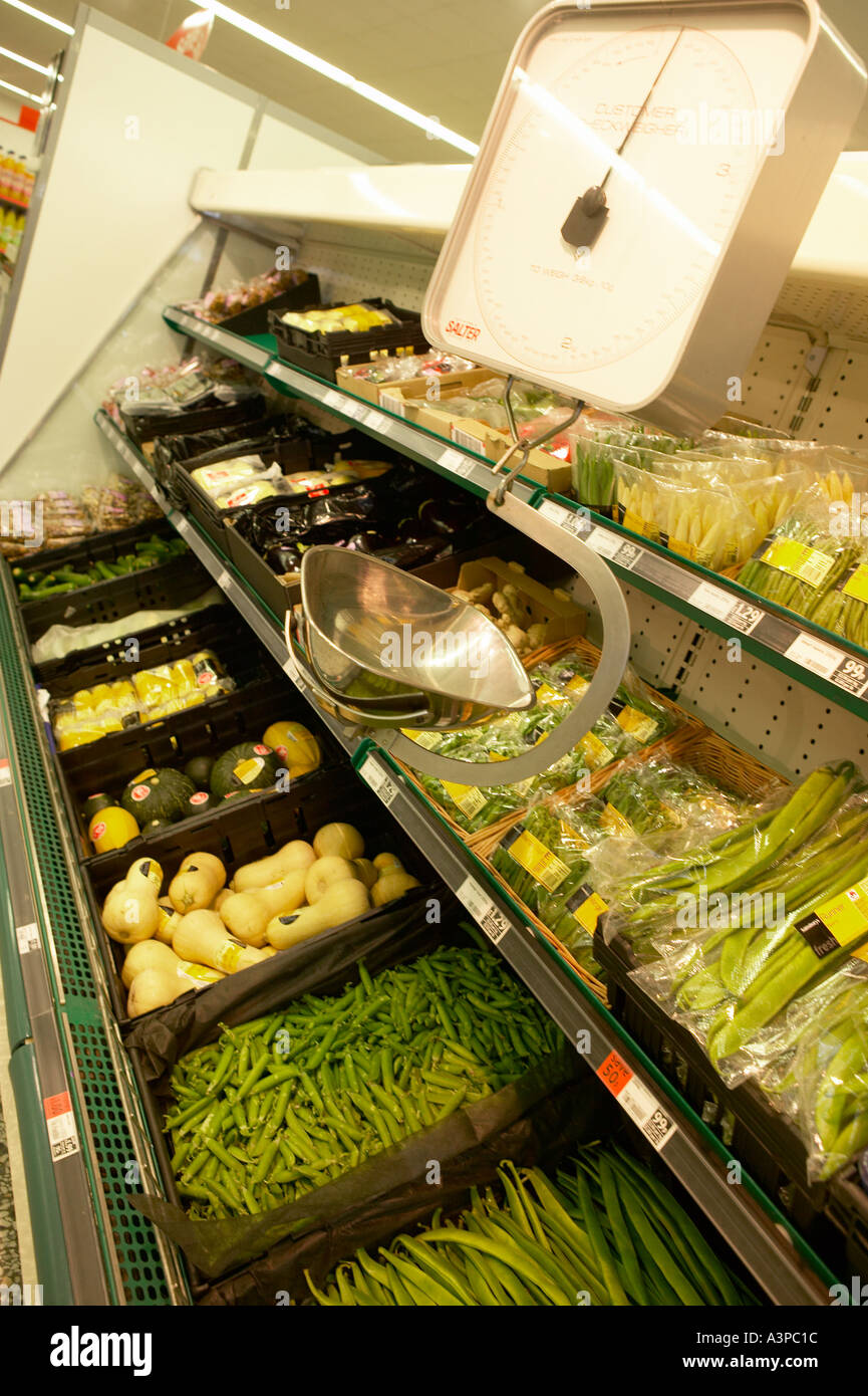 FRESH VEGETABLES ON SUPERMARKET SHELF WITH WEIGHING SCALES Stock Photo